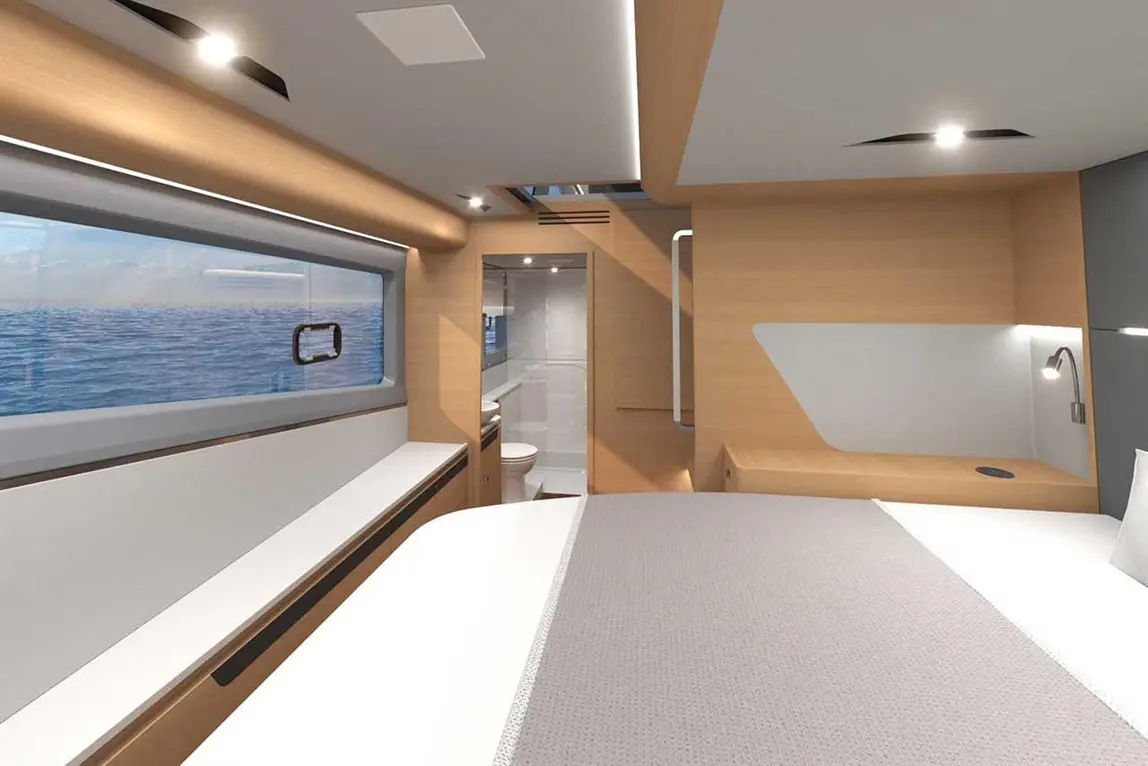 Modern boat interior featuring a double bed, wooden paneling, ocean view window, and a compact bathroom area.